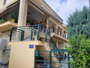 a apartment building with a balcony and stairs at Luxury Captain's Corner in Trikala, 3BD in Tríkala