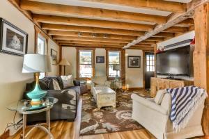 a living room filled with furniture and a flat screen tv at Majestic Mountain Retreat with Fire Pit Facing Mtn in Hunter