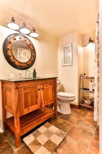 a bathroom with a sink and a toilet at Majestic Mountain Retreat with Fire Pit Facing Mtn in Hunter