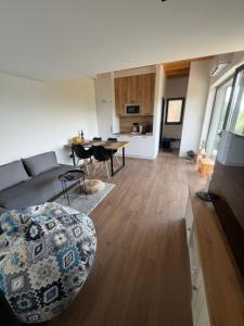 a living room with a couch and a table at Kucica na Brdu in Brda +40 photos