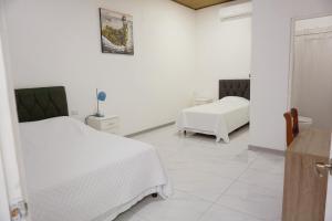 Postel nebo postele na pokoji v ubytování Cabinas La Sirena