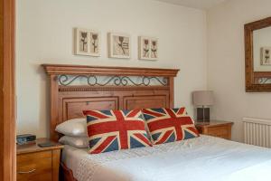 En eller flere senge i et værelse på Bens Row Cottage, The Lake District