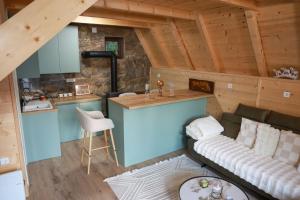 an overhead view of a kitchen and living room in a log cabin at Wild Lodges in Žabljak