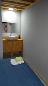 a bathroom with a sink and a mirror at Alojamiento Loft céntrico in Esperanza