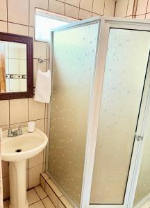 a bathroom with a shower and a sink at Sweet Home Carrión in Fortuna +16 photos