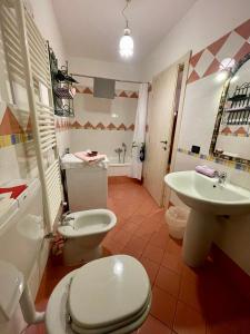a bathroom with a toilet and a sink at B & B La Ca' Di Massuc in Peveragno +33 photos