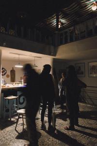 a group of people standing in a room at El MOJA SURFHOUSE in Sidi Ifni