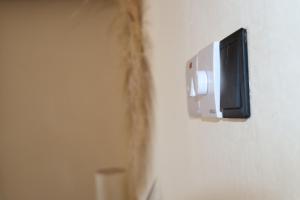 a tv attached to a wall with a wall at B Home Zanzibar in Kiwengwa