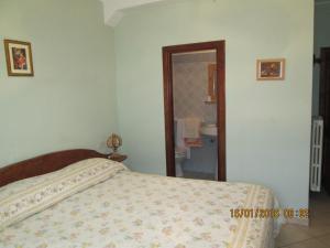 Postel nebo postele na pokoji v ubytování Anticarua B&B