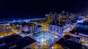 Nespecifikovaný výhled na destinaci Capão da Canoa nebo výhled na město při pohledu z apartmánu + 4 fotografie