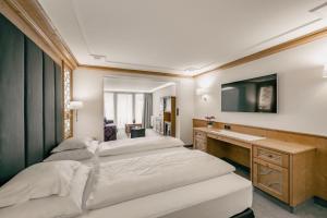 Łóżko lub łóżka w pokoju w obiekcie Gourmet & Wine Hotel Austria - 4 Sterne superior