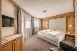 Łóżko lub łóżka w pokoju w obiekcie Gourmet & Wine Hotel Austria - 4 Sterne superior