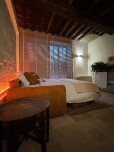 a bedroom with a bed and a large window at La Maison Naturospa in Chaumont +61 photos