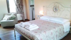 Postel nebo postele na pokoji v ubytování B&B "Corte San Tomaso"