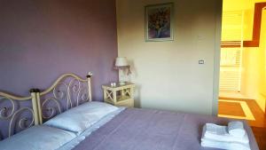 Postel nebo postele na pokoji v ubytování B&B "Corte San Tomaso"