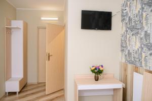 TV a/nebo společenská místnost v ubytování Urban Hotel