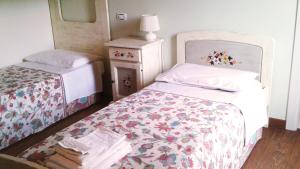 Postel nebo postele na pokoji v ubytování B&B "Corte San Tomaso"