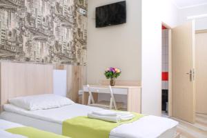 Postel nebo postele na pokoji v ubytování Urban Hotel