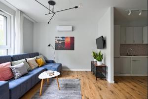 Televízia a/alebo spoločenská miestnosť v ubytovaní UrbanNestapartments-Op51