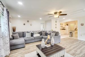 a living room with a couch and a table at 2 Mi to Beach and AFB Family Home in Biloxi in Biloxi