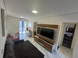 Et tv og/eller underholdning på Excelente apartamento - Itaguá