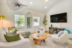 a living room with two couches and a tv at Heated Pool, Mini Golf and Cabana Bradenton Retreat in Bradenton