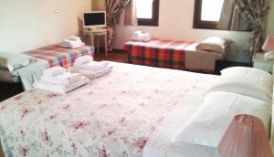 Postel nebo postele na pokoji v ubytování B&B "Corte San Tomaso"