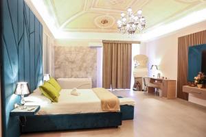 Ένα ή περισσότερα κρεβάτια σε δωμάτιο στο B&B Suites&Rooms piazza dei martiri