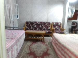 Postel nebo postele na pokoji v ubytování 35 ادفو علي امين