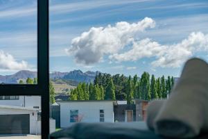 a view of a mountain range from a window at Willow Lane in Albert Town