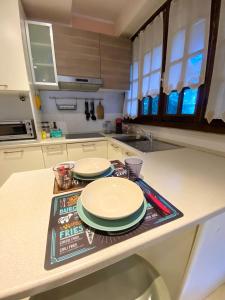 A kitchen or kitchenette at Bellagio Cool Flat - Private Parking & Rooftop terrace
