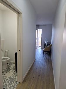 an empty room with a door leading to a bathroom at E - Beautiful 2 bedroom Terraced Home in Machico +22 photos