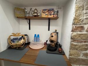 a kitchen counter with a coffee maker on it at Farrose in Naples