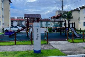 a playground with a slide in a park at Cantinho dos Sonhos in Mangaratiba