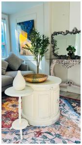 a living room with a table with a plant on it at The Stays - Private Cozy 2BHR Apt on main floor in Toronto