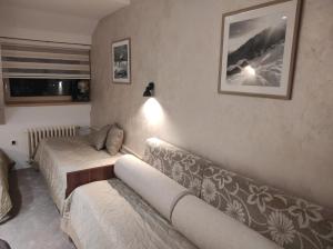 a living room with a couch at Apartmani Iva Kop Konaci in Kopaonik