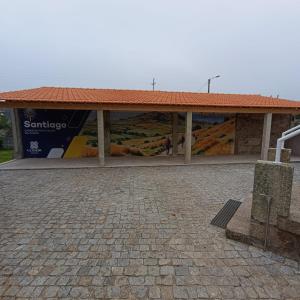 a building with a sign on the side of it at Albergue Ultreya in Esposende