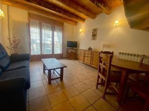 TV a/nebo společenská místnost v ubytování Apartamentos Fogaron