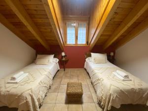Postel nebo postele na pokoji v ubytování Apartamentos Fogaron