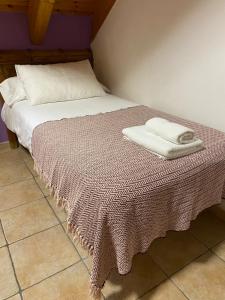 Postel nebo postele na pokoji v ubytování Apartamentos Fogaron