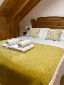 Postel nebo postele na pokoji v ubytování Apartamentos Fogaron