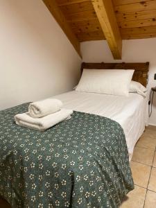 Postel nebo postele na pokoji v ubytování Apartamentos Fogaron