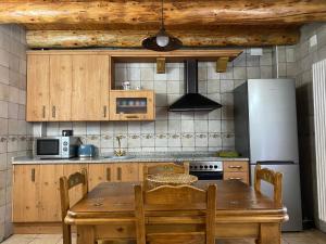 Kuchyň nebo kuchyňský kout v ubytování Apartamentos Fogaron