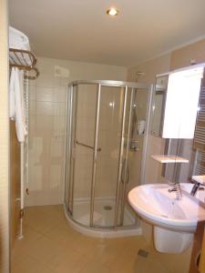 a bathroom with a shower and a sink at Apartment 116 in Jahorina