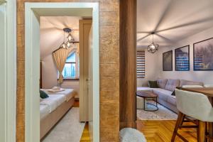 a living room with a couch and a table at Apartman Vuk Zlatibor in Zlatibor