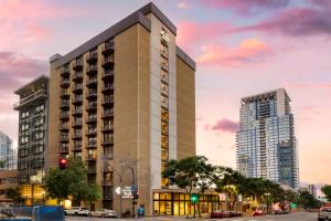 a rendering of a building with two tall buildings at Best Western Plus Bayside Inn in San Diego