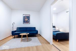 A bed or beds in a room at BORG Apartmanok