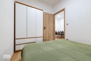A bed or beds in a room at BORG Apartmanok