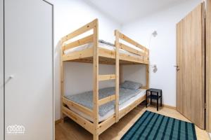 A bed or beds in a room at BORG Apartmanok