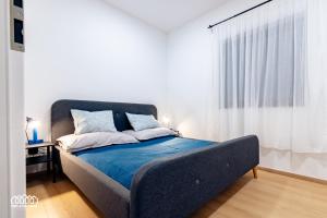 A bed or beds in a room at BORG Apartmanok